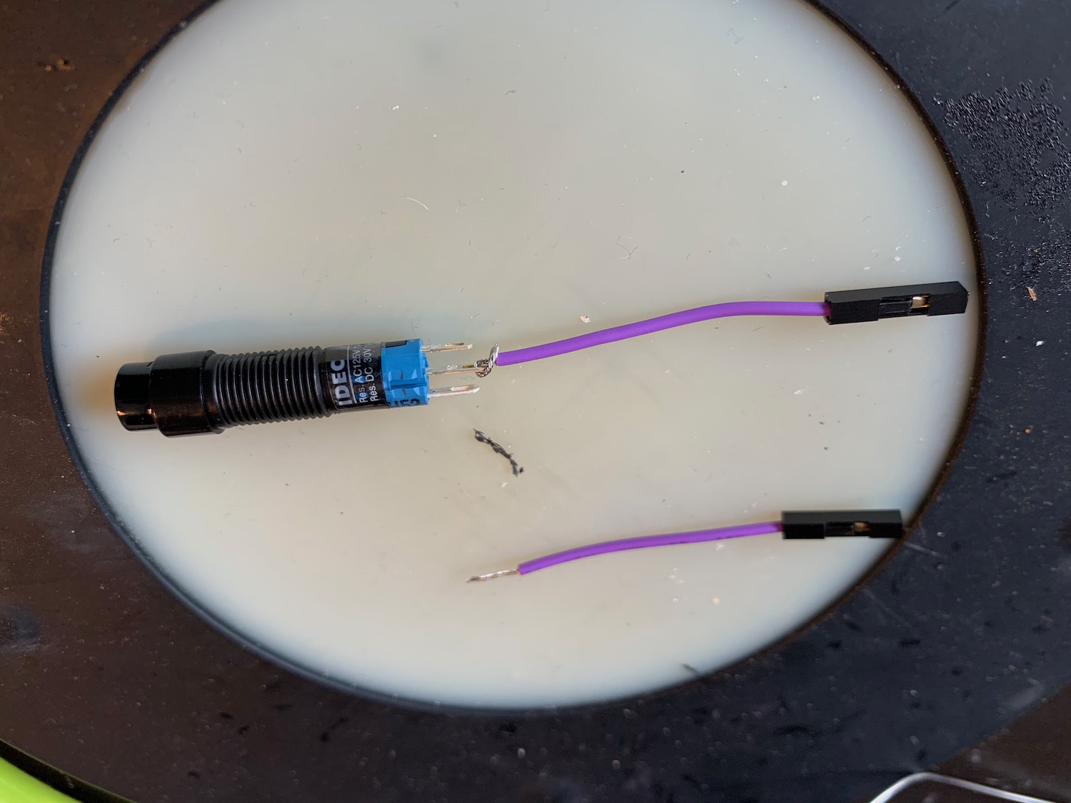 Image showing the jumper wire looped around the button pins and socket at the other end